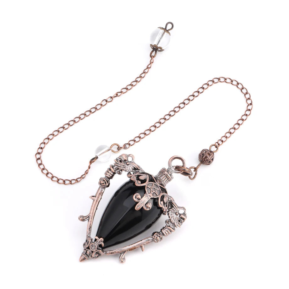 Necklace with a black pendant and rose gold chain on a white background