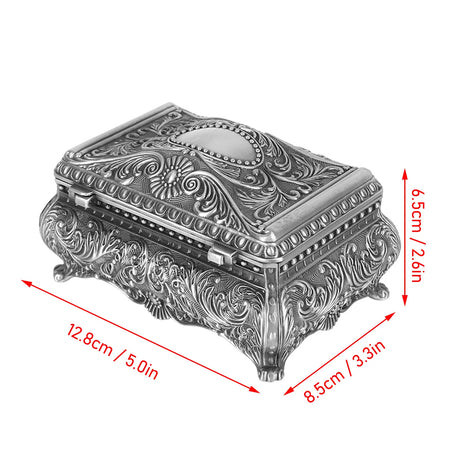 Decorative silver box with intricate designs and dimensions indicated on a white background