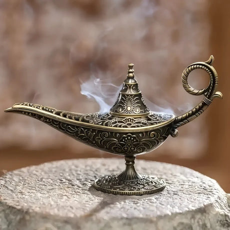 Decorative incense burner with intricate designs on a stone surface