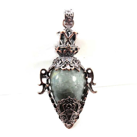 Decorative pendant with a green stone on a white background