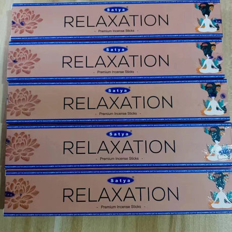 Multiple boxes of Satya Relaxation incense sticks on a light background