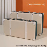Two beige suitcases with dark green accents on a light background