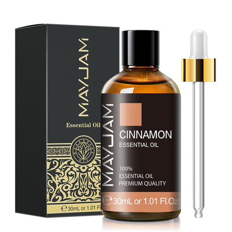 MayJam Cinnamon Essential Oil bottle with dropper and packaging on a white background