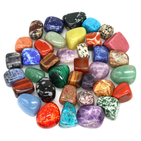 Assorted colorful gemstones on a white background
