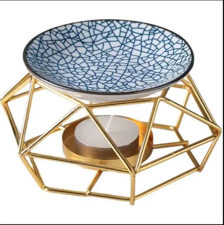 Decorative oil burner with cracked glass dish and gold geometric base
