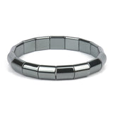 Silver bracelet with hexagonal links on a white background