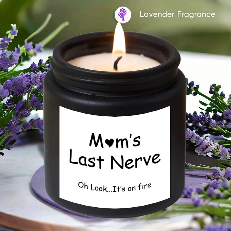 Candle labeled 'Mom's Last Nerve' with lavender fragrance, surrounded by lavender flowers.