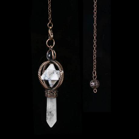 Necklace with a crystal pendant and chain on a black background