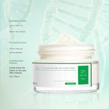 Jar of cream with a green label on a light blue background