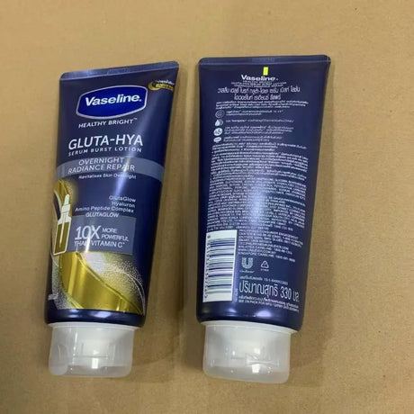 Vaseline Gluta-Hya lotion tube on a brown background