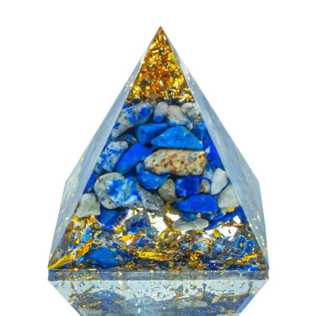 Pyramid-shaped crystal with blue and gold stones on a white background