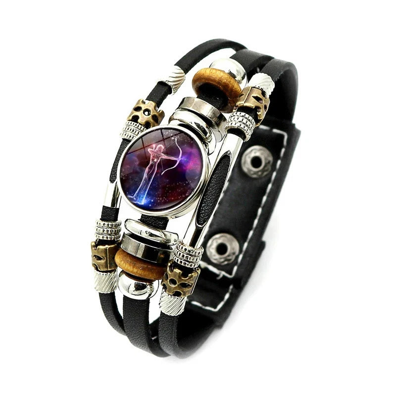 Multistrand bracelet with beads and a central circular design on a white background