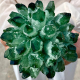 Close-up of a green crystal rock held by a person
