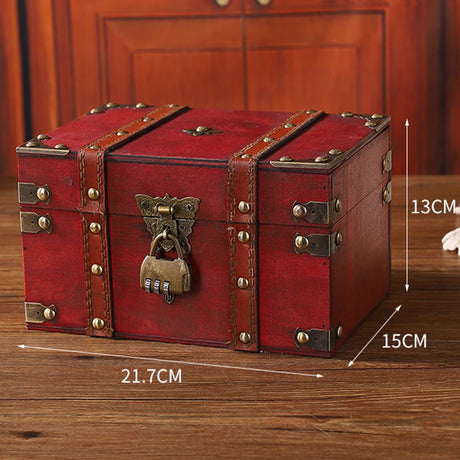 Red wooden treasure chest with brass lock and measurements on a wooden surface