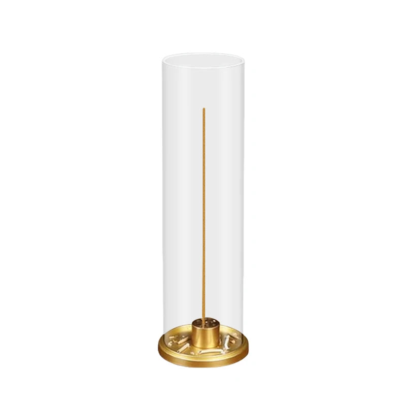 Cylindrical lamp with a gold base on a white background