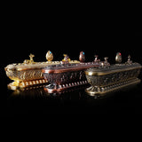 Decorative set of ornate boxes with intricate designs on a black background