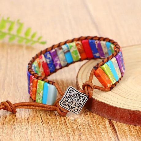 Colorful bracelet with a decorative clasp on a wooden surface