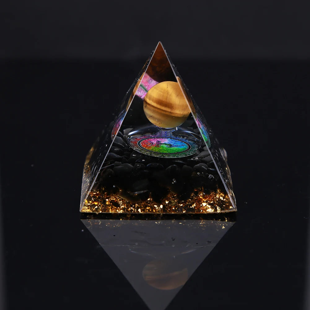Pyramid-shaped object with a reflective surface on a black background