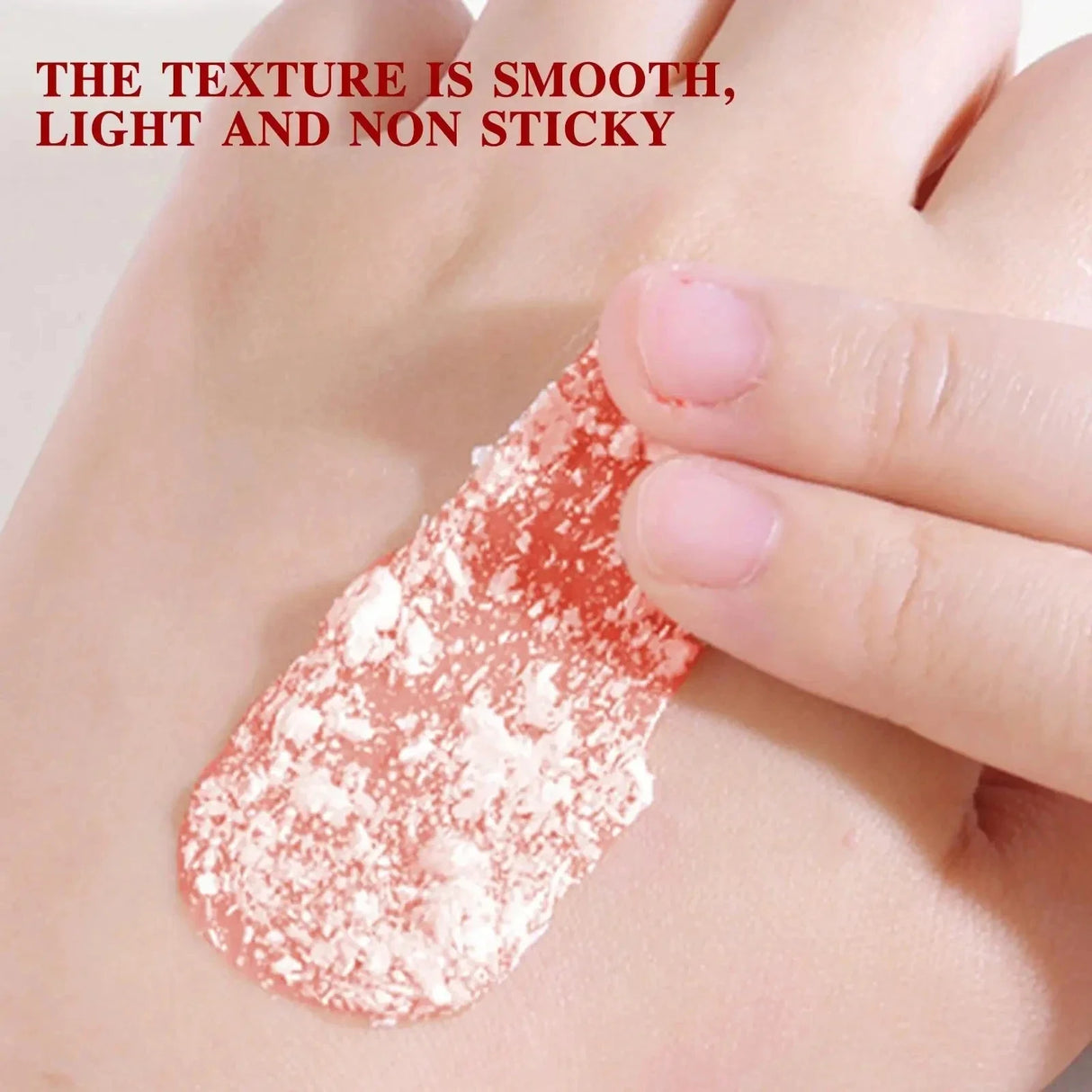 Hand applying a smooth, light, non-sticky substance to skin