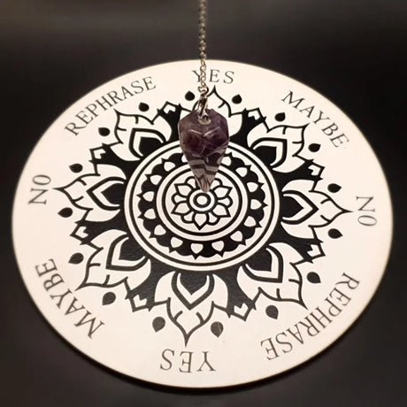 Circular mandala pendant with text on a black background