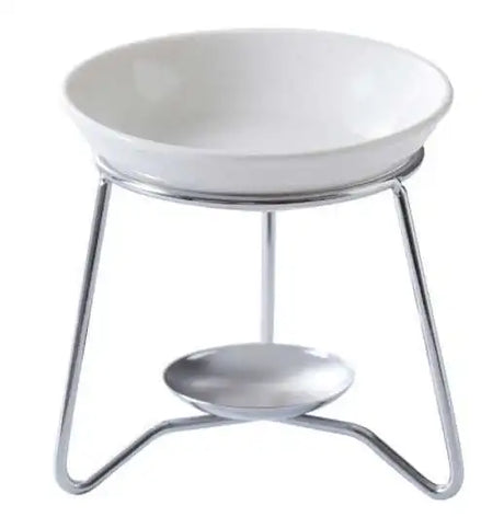 White ceramic bowl with metal stand on a white background