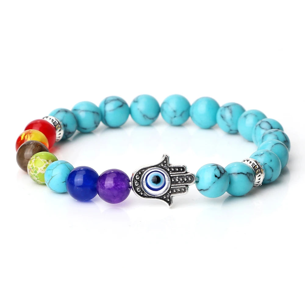 Multicolored beaded bracelet with a Hamsa hand charm on a white background