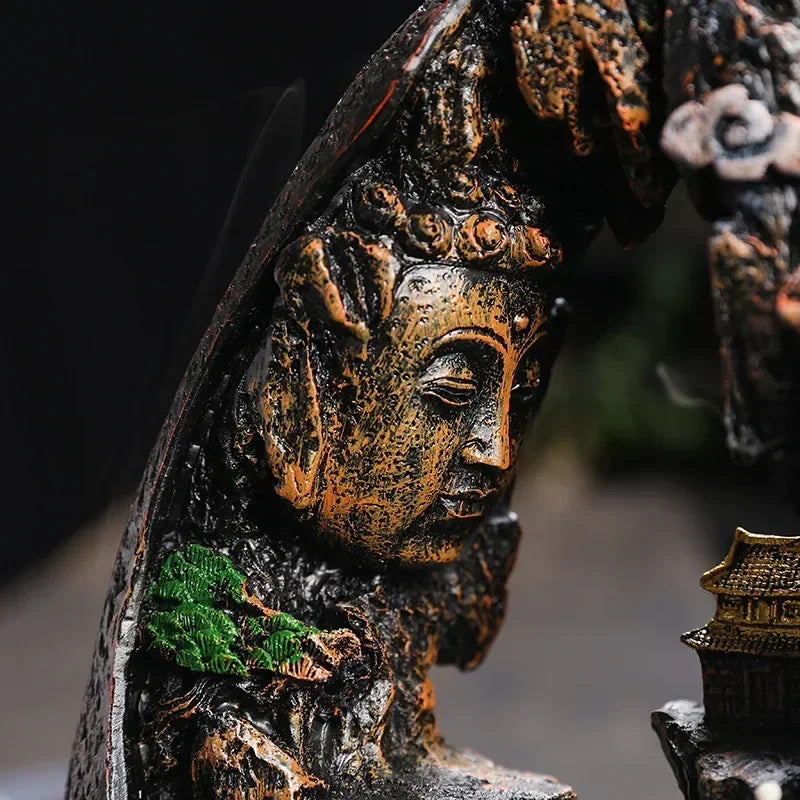 Close-up of a detailed bronze statue with a blurred background
