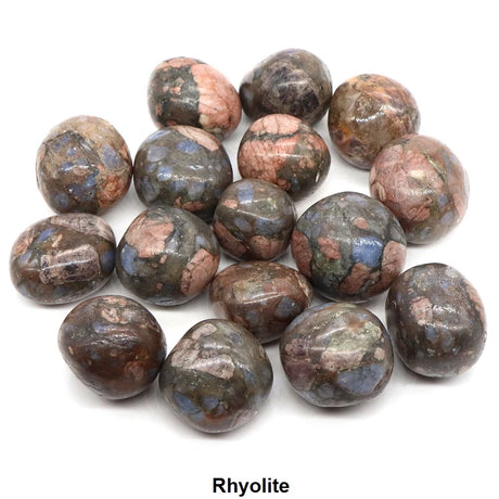 Collection of rhyolite stones on a white background