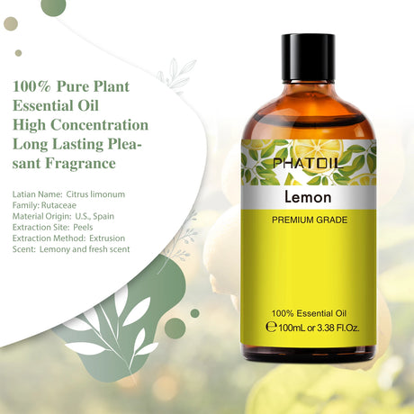 Bottle of lemon essential oil with a green leafy background