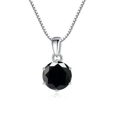 Black gemstone pendant on a silver chain against a white background