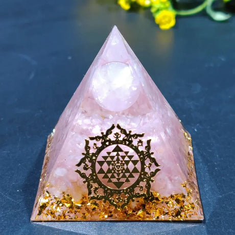 Crystal pyramid with Sri Yantra symbol on a blue background