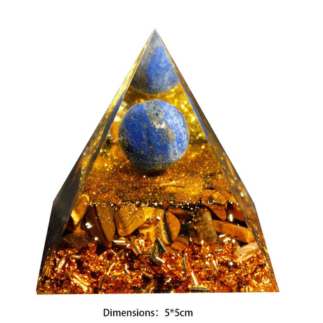 Triangular pyramid with blue crystal ball and gold flakes on a white background
