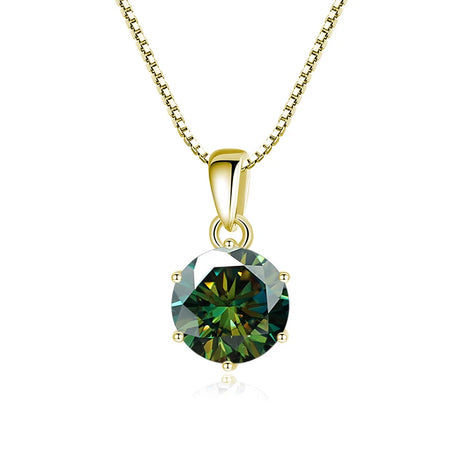 Gold pendant with a green gemstone on a white background