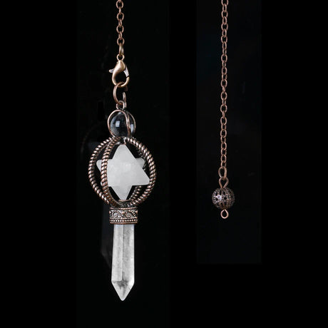 Crystal key pendant with chain on a black background