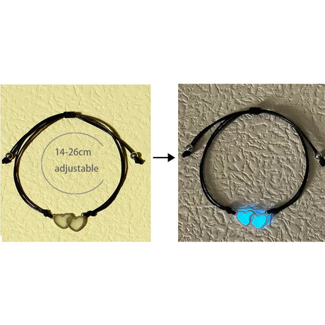 Black adjustable bracelet with heart-shaped beads on a textured surface
