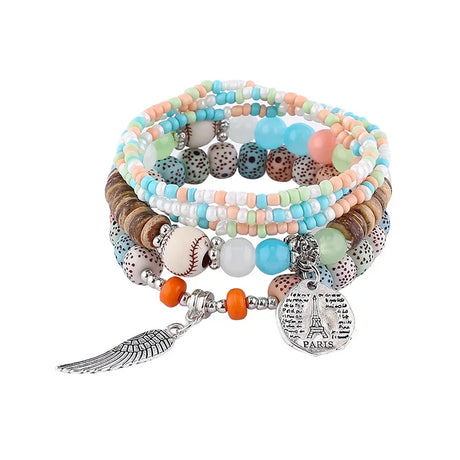 Set of colorful beaded bracelets with charms on a white background