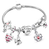 Silver bracelet with various charms including hearts and animals on a white background