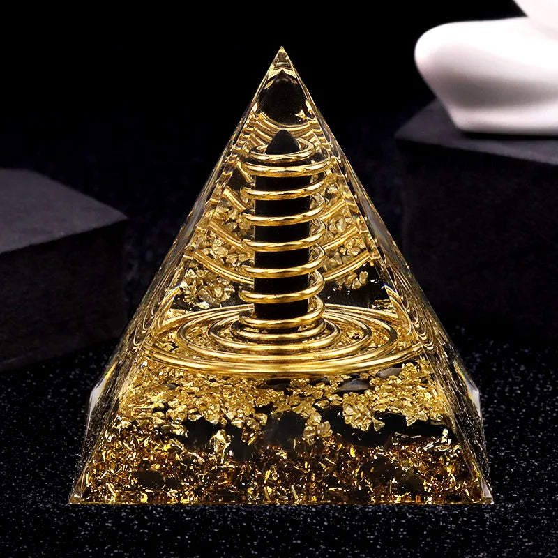 Gold pyramid-like object on a black background