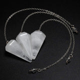 Necklace with five stone pendants on a black background