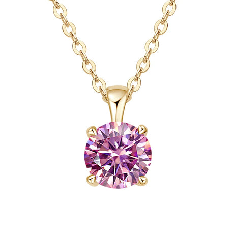 Gold necklace with a pink gemstone pendant on a white background