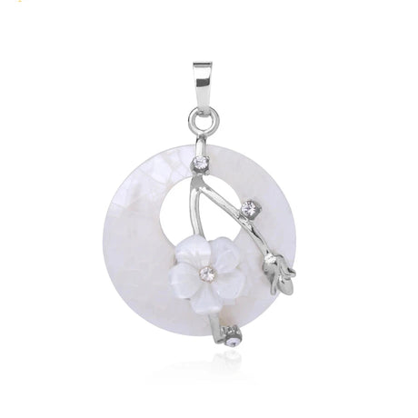 Silver pendant with floral design on a white background