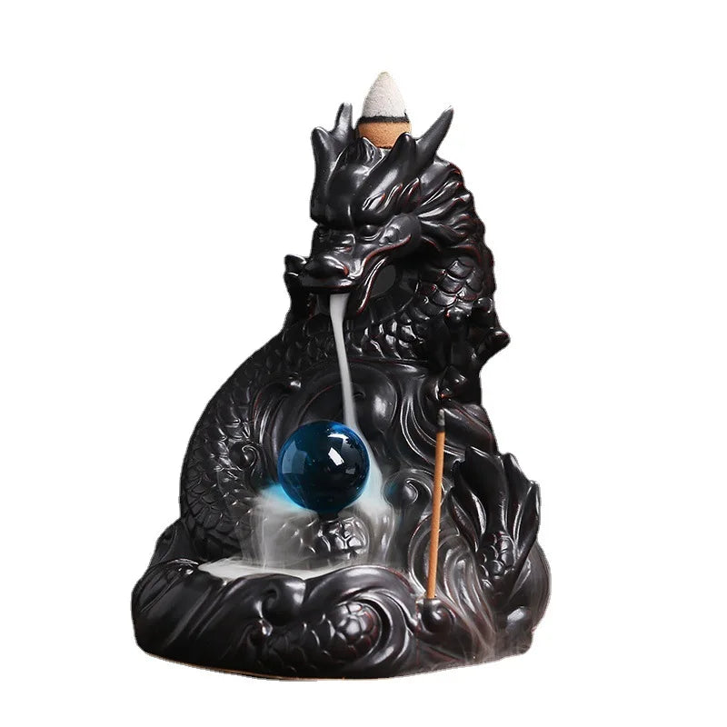 Dragon-shaped incense burner with a blue orb on a white background