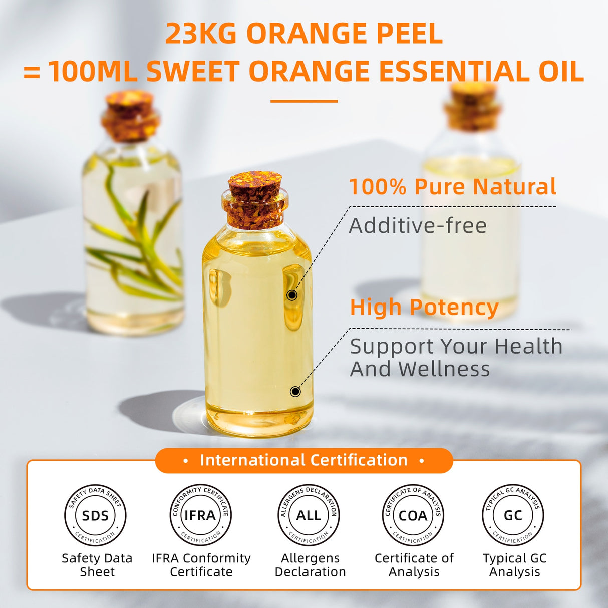 Bottle of sweet orange essential oil with certification logos on a light background