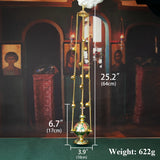 Decorative gold lamp with measurements and weight displayed against a dark background.