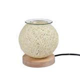 Decorative lamp with woven design and wooden base on a white background