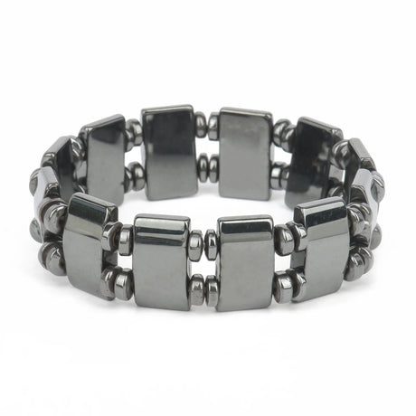 Silver bracelet with geometric beads on a white background