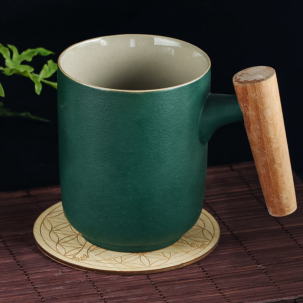Green mug with wooden handle on a coaster, dark background