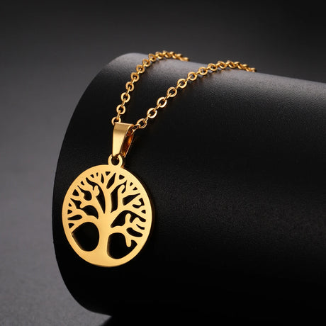 Gold tree-of-life necklace on a black background