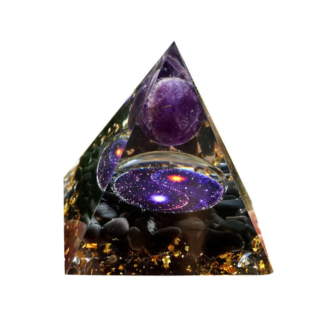 Triangular crystal with purple sphere and galaxy-like design on a white background