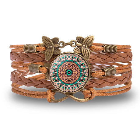 Brown leather bracelet with decorative clasp on a white background